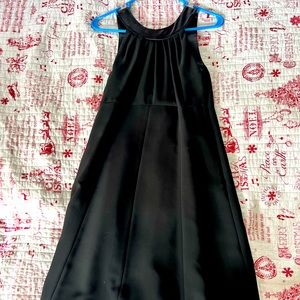 Black dress with low back, silk detail around bottom